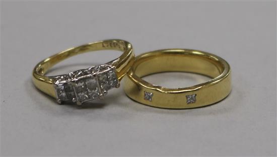 An 18ct gold and diamond cluster ring and a yellow metal and diamond set ring.